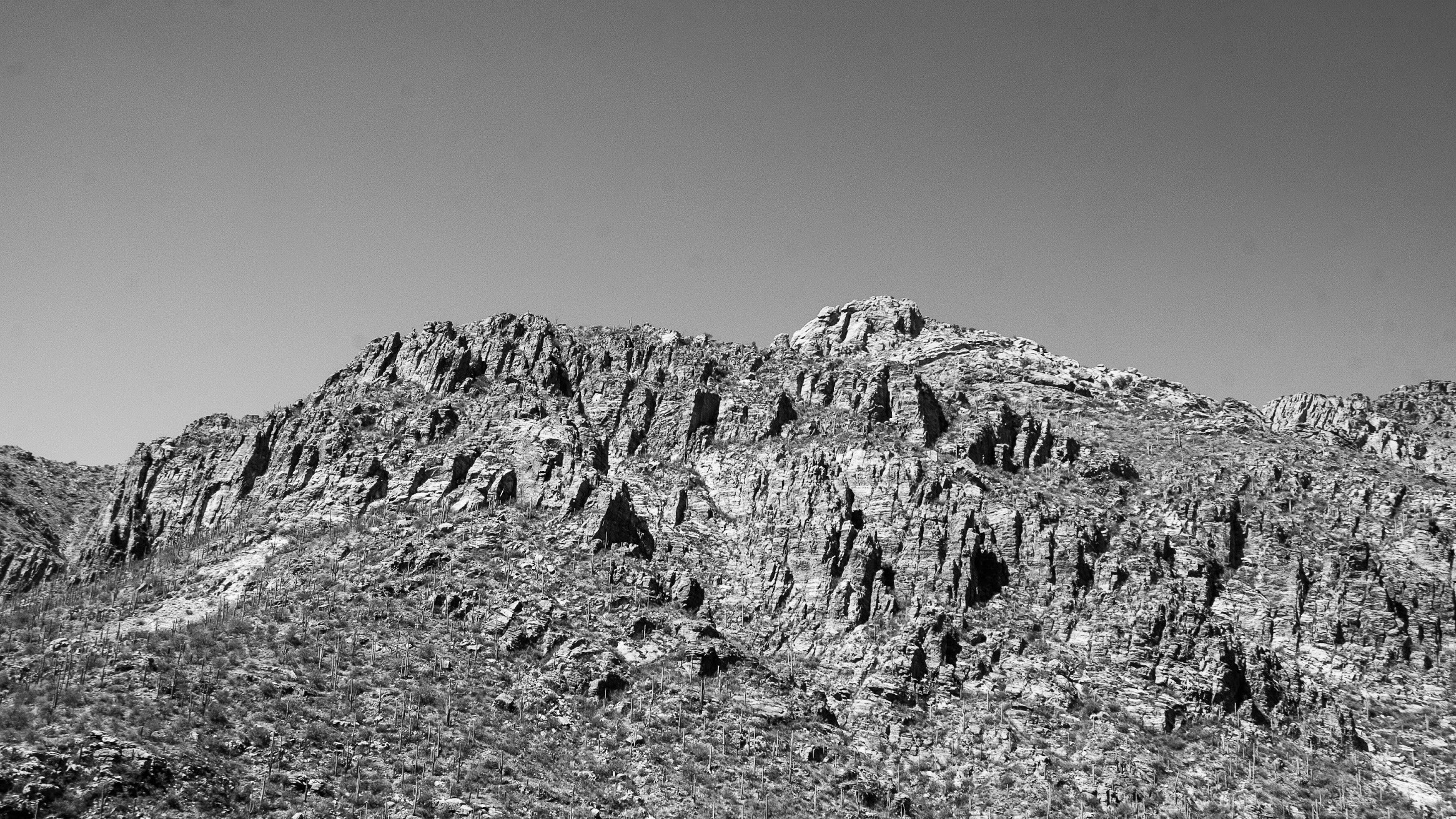A black and white photo of beautiful local mountains.
